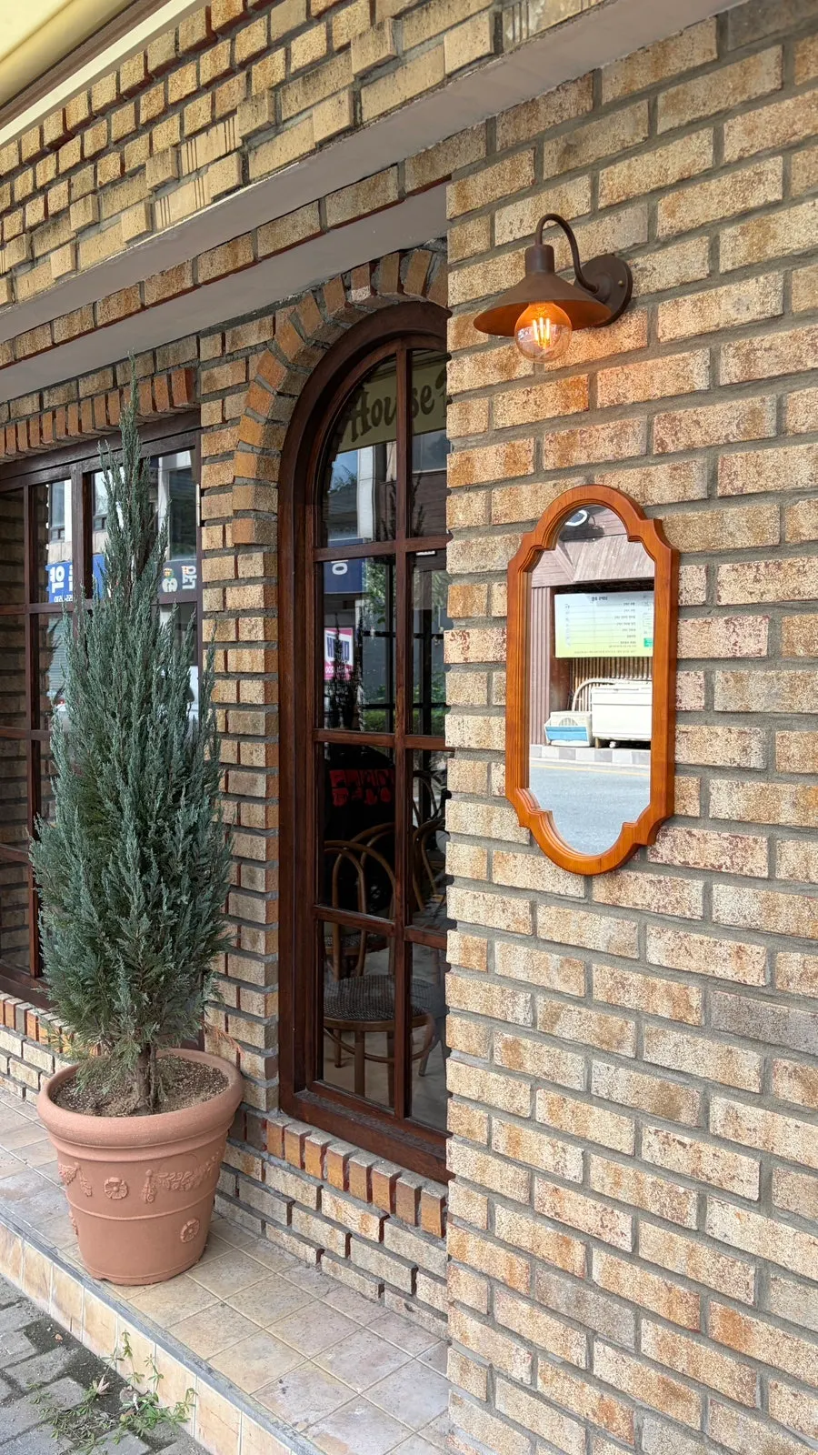 Mirror and doorway just inside the entrance