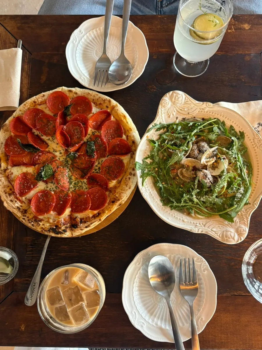 Table with pizza and pasta together