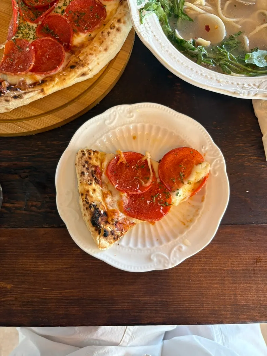 Thin-crust pizza loaded with pepperoni