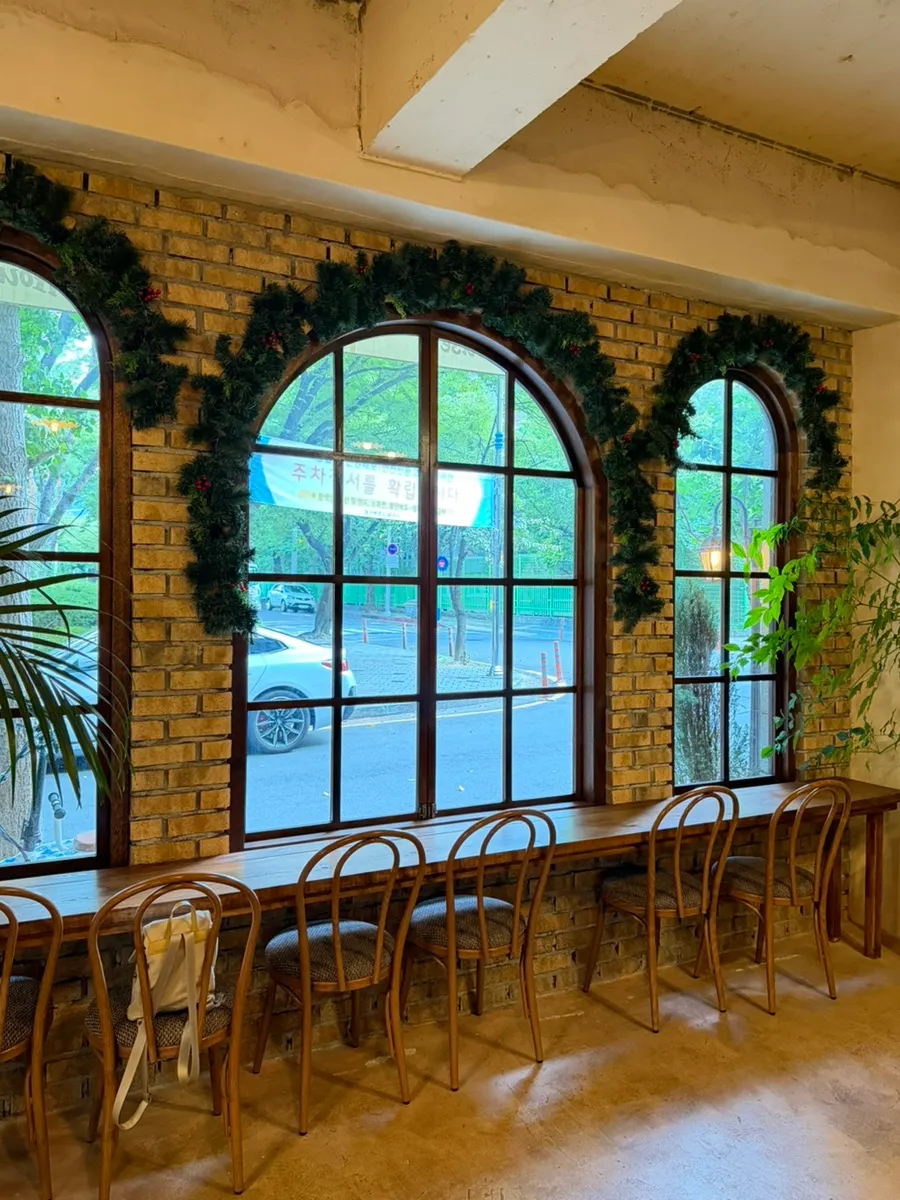 European-style café exterior with brick walls and arched windows