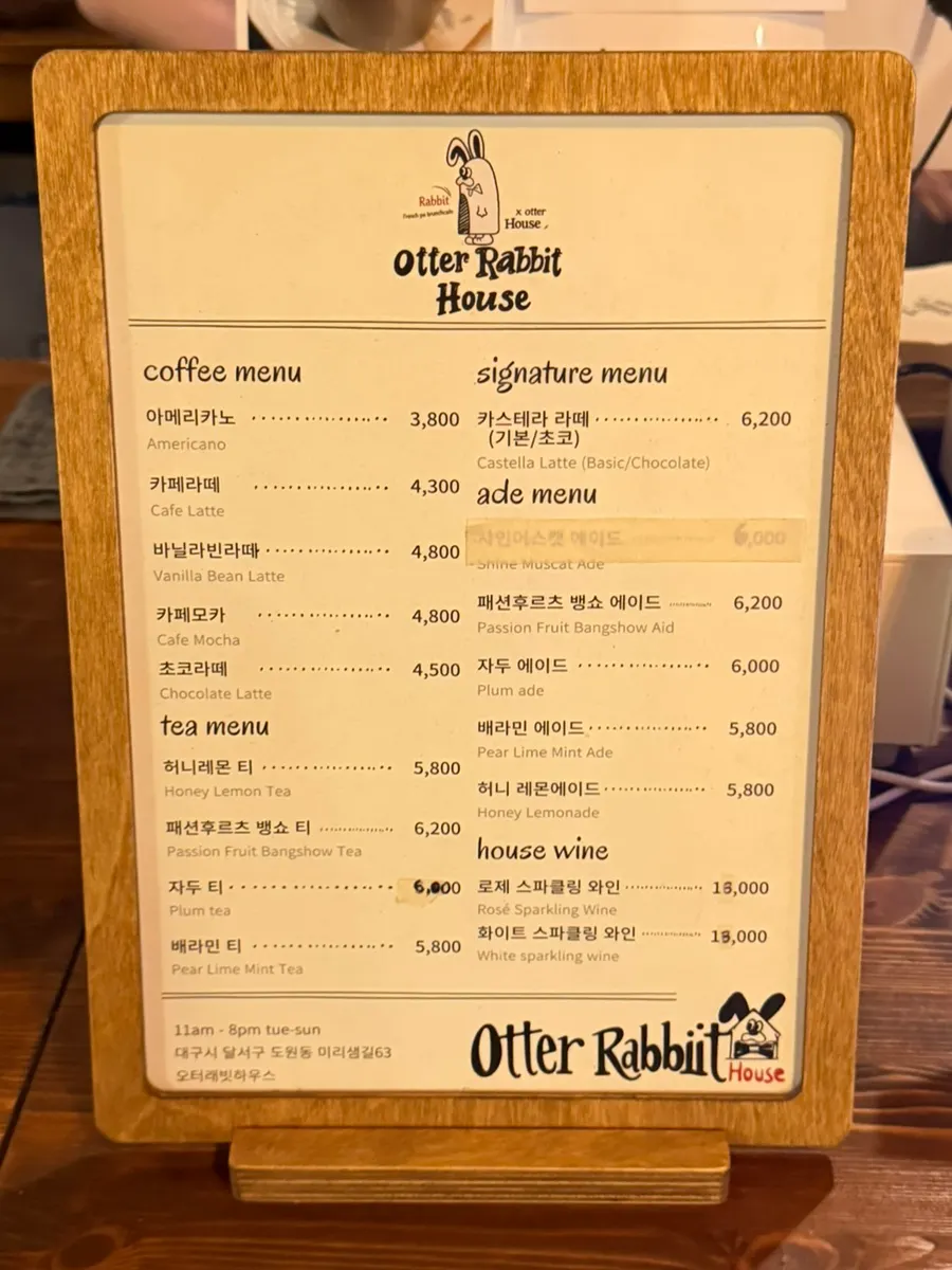 Drinks menu board listing the castella latte