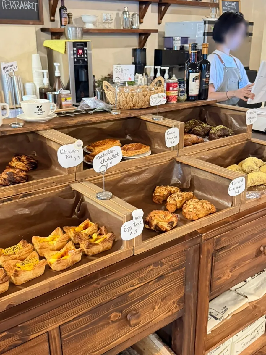 Bakery display case with pies and tarts