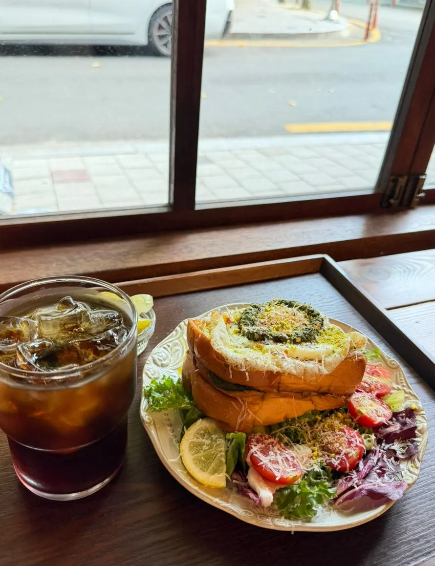 Egg basil French toast with a decaf iced americano
