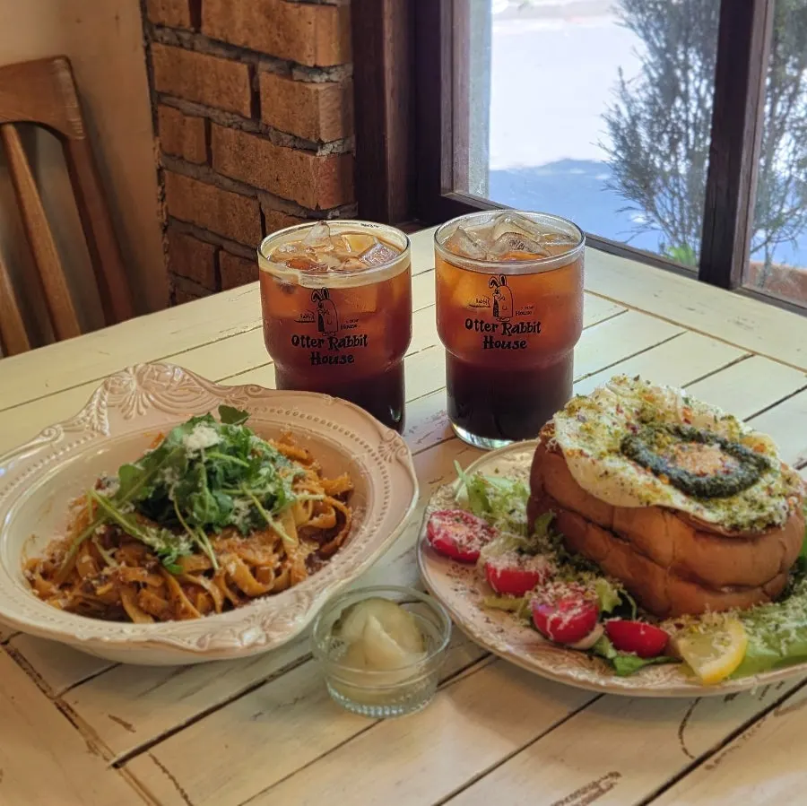 Table set with pasta and French toast plates