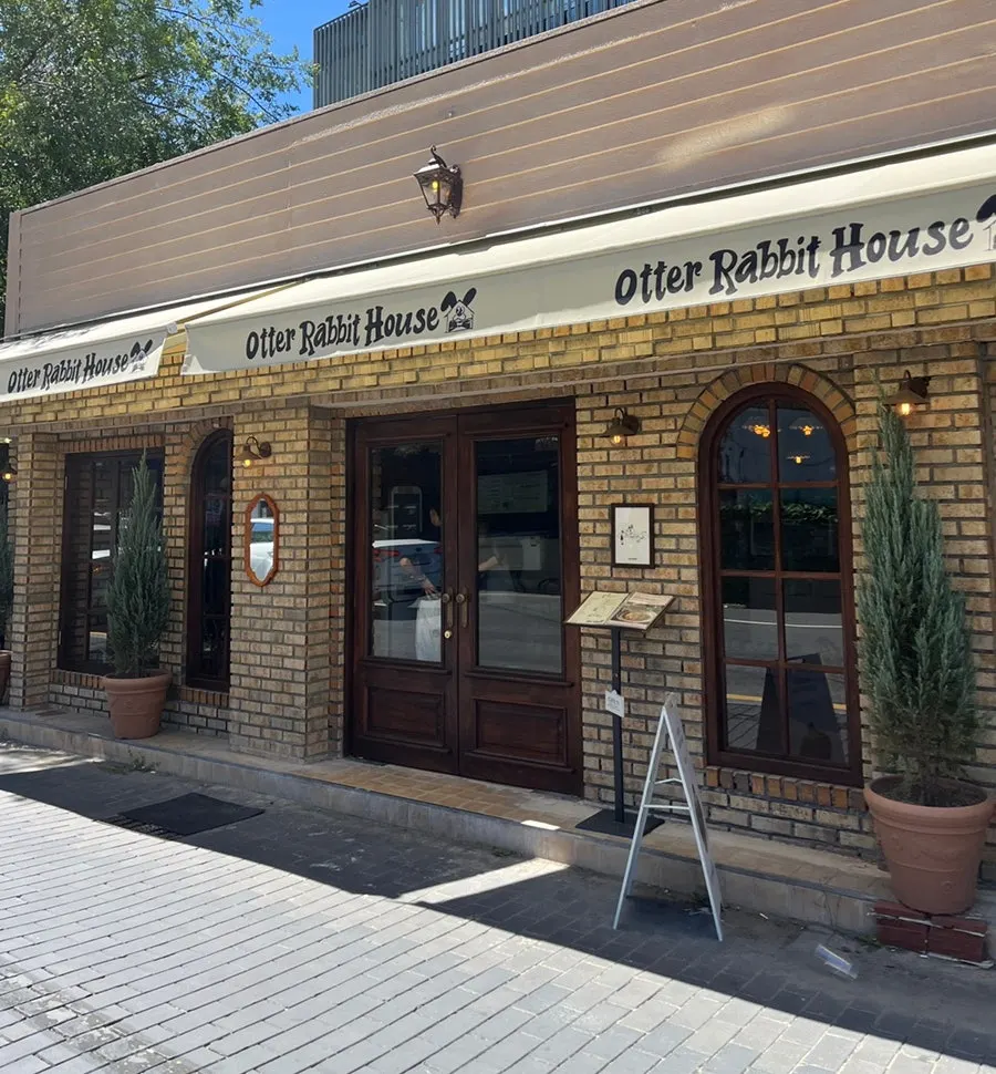 European-style café exterior with brick and lighting