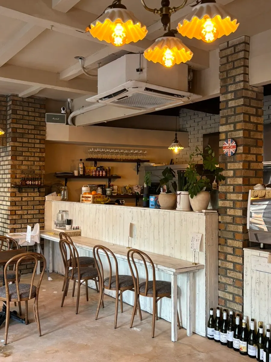 Café seating beside the full window wall