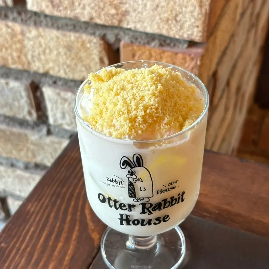 Castella crumb piled generously on top of the latte