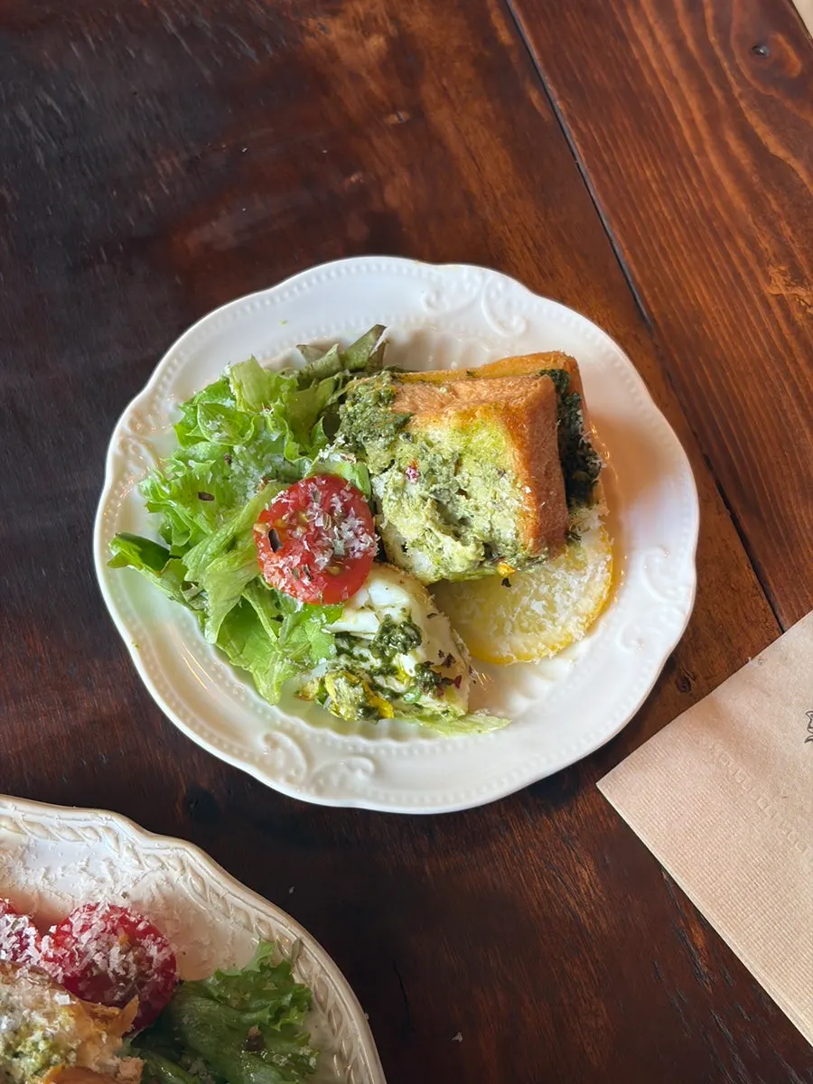 A piece of toast portioned onto a small plate