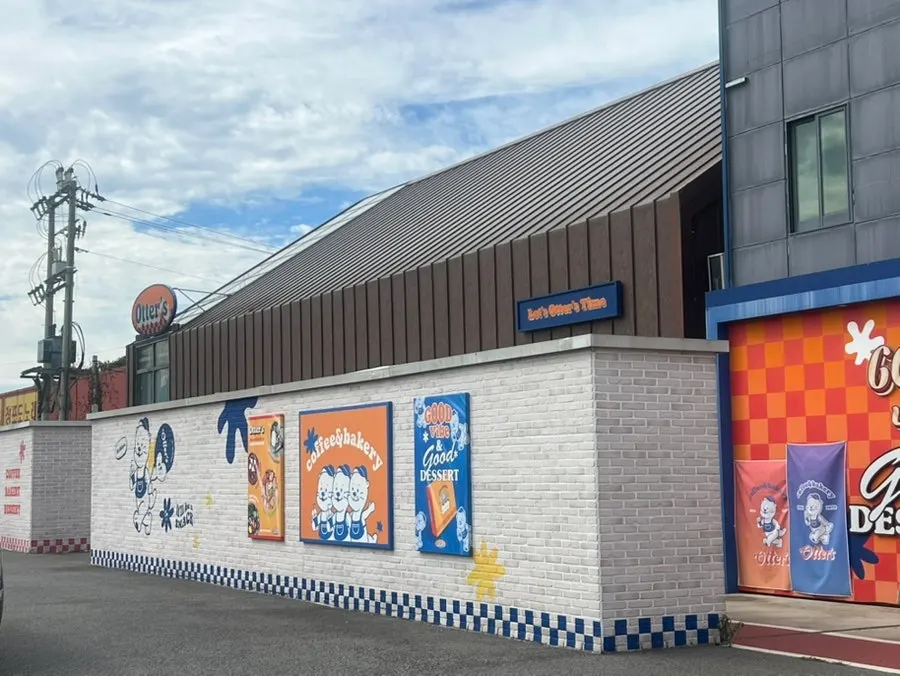 Café exterior featuring the otter mascot