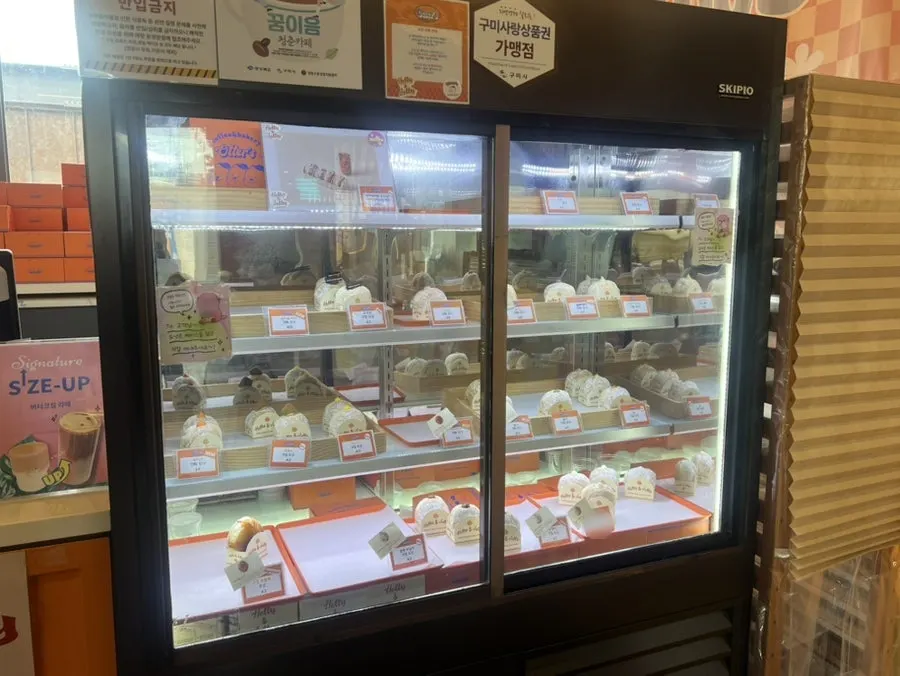 Display case with a wide variety of doughnuts