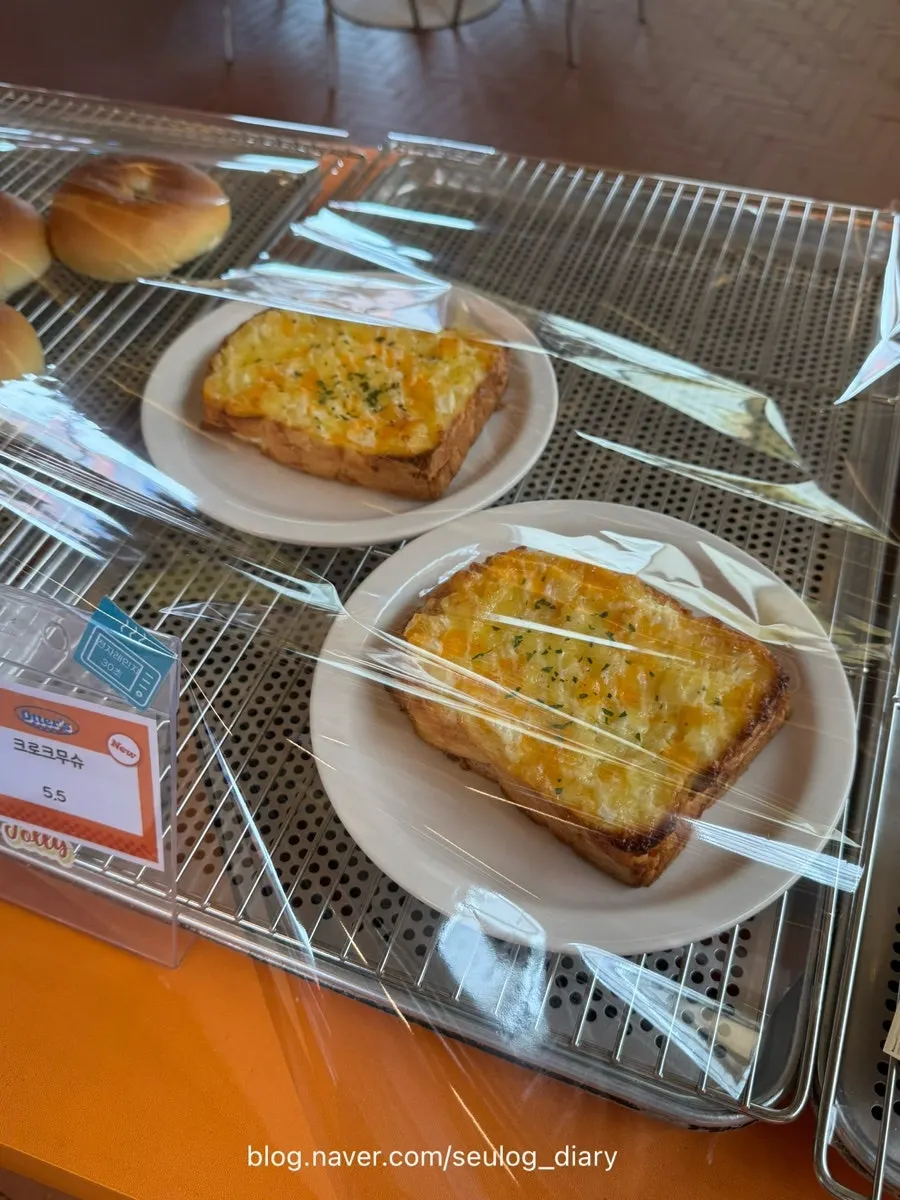 Bakery display case with salt bread and croissants