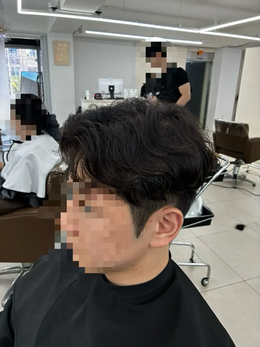 Bangs with natural curl after the side-part perm