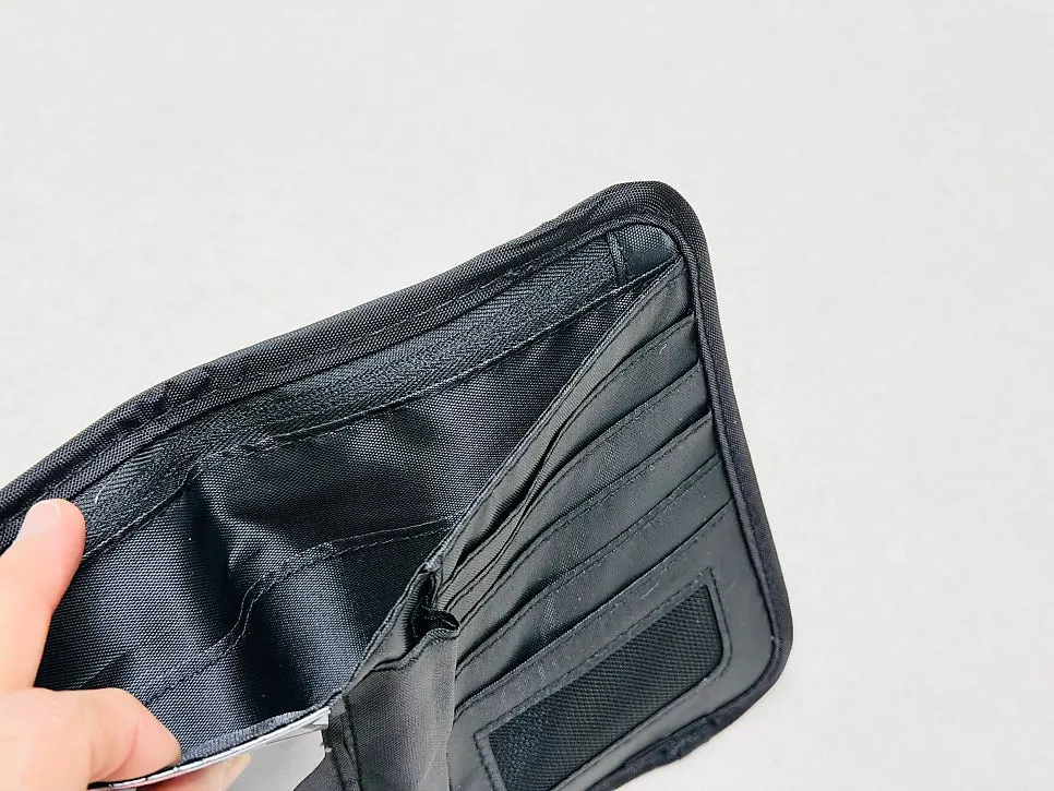 Passport wallet compartment for bills and paper receipts