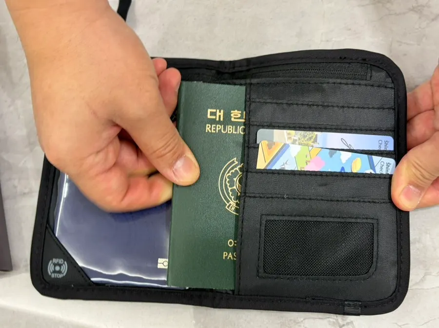 Passport case slots organizing frequently used cards