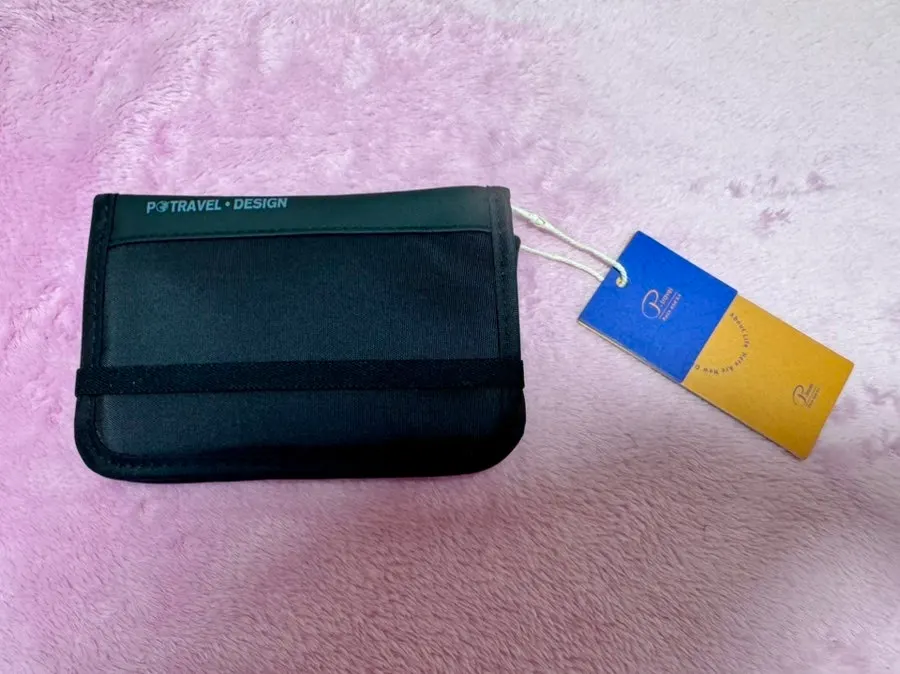 Packly passport wallet packed with travel essentials