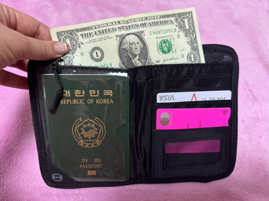 Packly passport wallet closed with an elastic cord