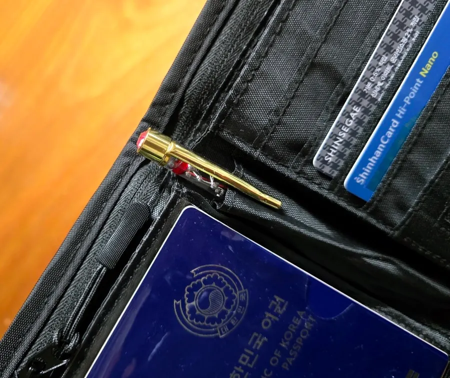 Pen slot in the center of the Packly passport wallet