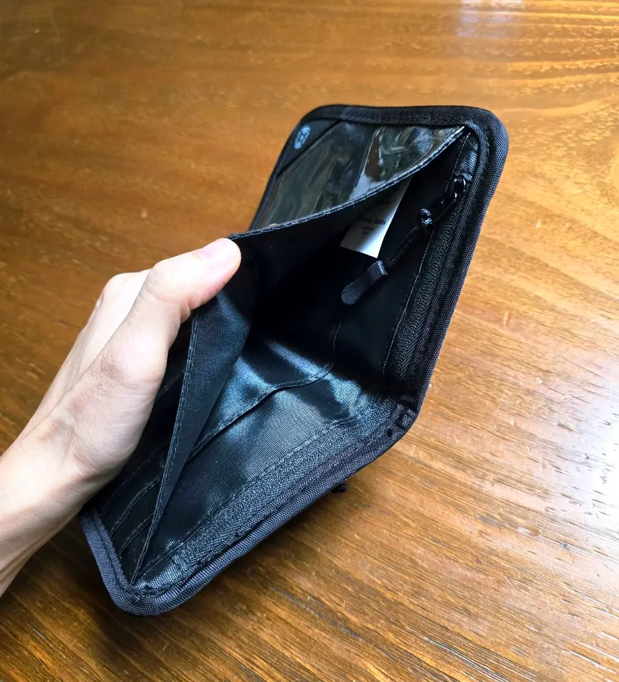 Bill compartments inside the unfolded Packly passport wallet