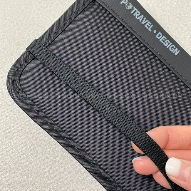 Packly travel passport bag that opens and closes with a band