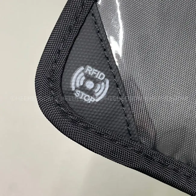 Interior storage of the Packly passport bag opened after undoing the band