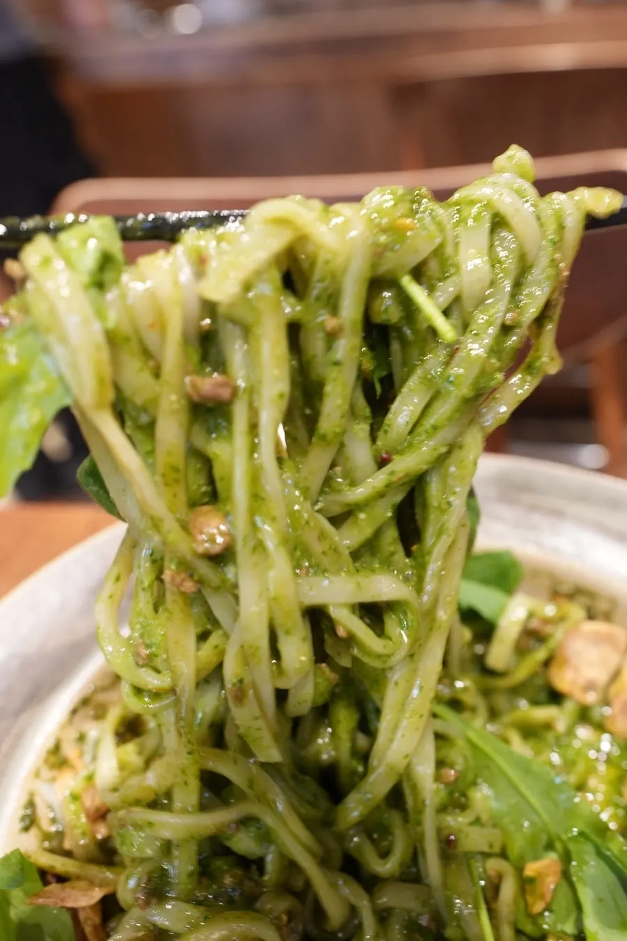 Basil soba mixed with the burst egg yolk