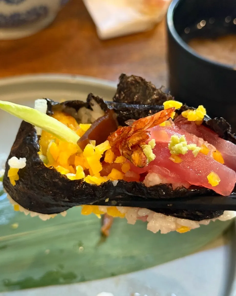 Cross-section of futomaki showing tuna, fried shrimp, and rolled egg