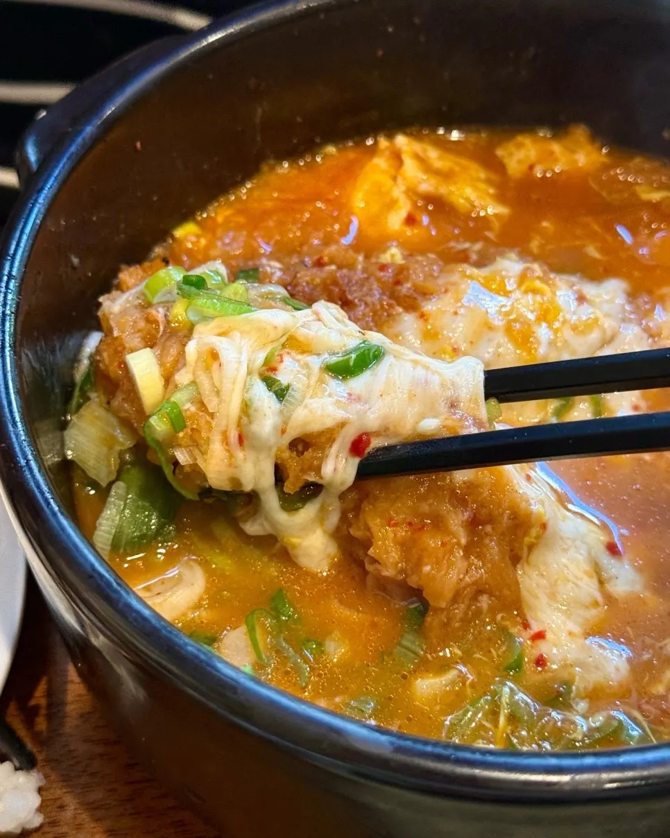 Nabe bowl filled with three handmade fried shrimp
