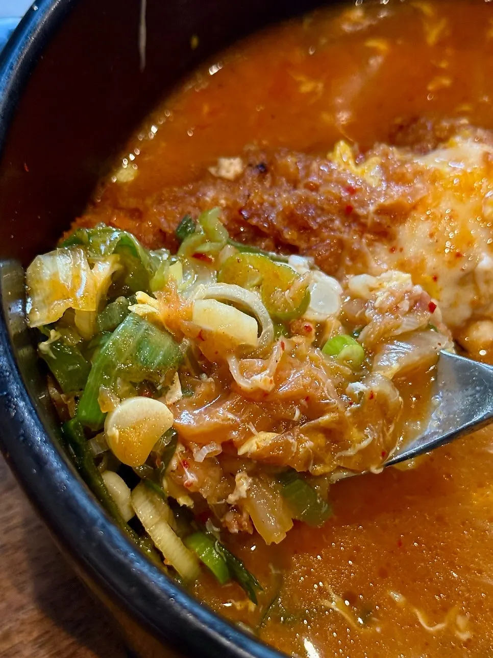 Cheese scooped up from the kimchi cheese nabe