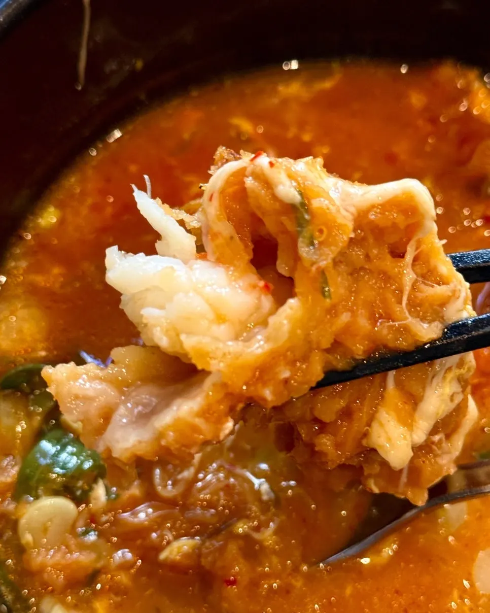 Plump fried shrimp sitting in the broth