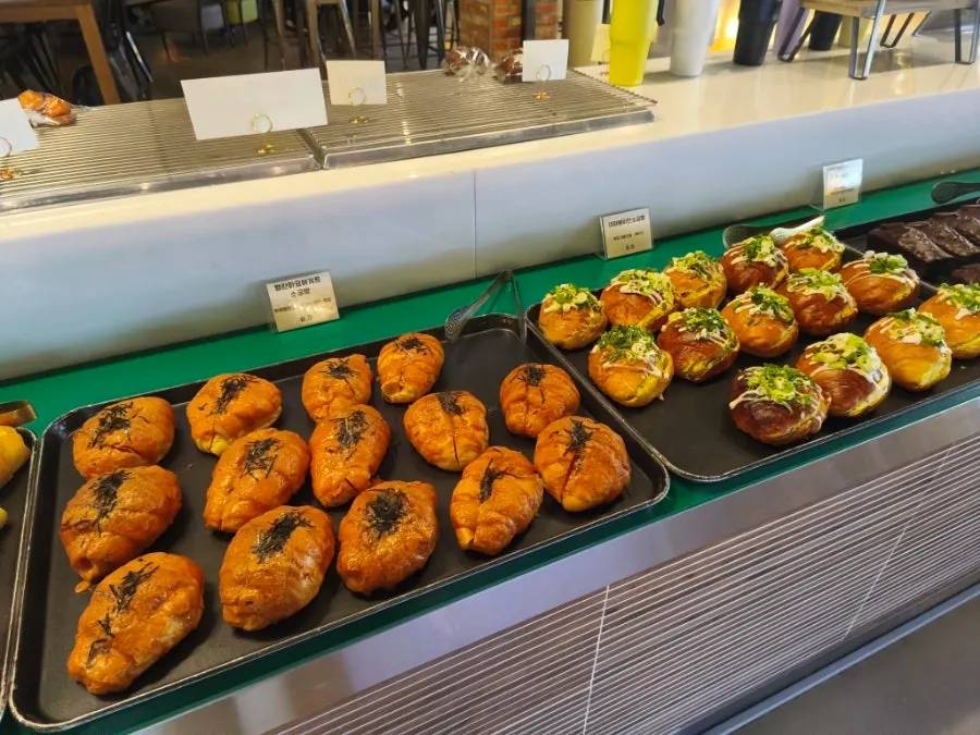 Assorted breads on the Barirus bakery display shelf