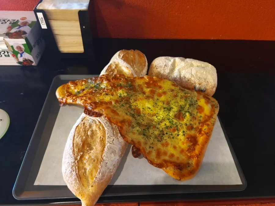 Cod roe salt bread tucked underneath the garlic naan at Barirus