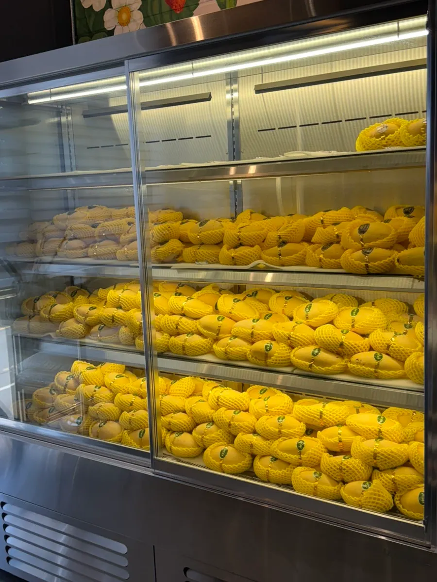 Mango display shelf inside the café