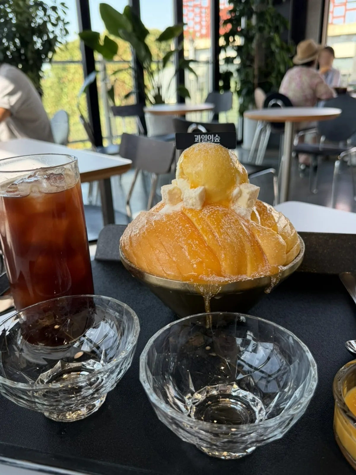 Thickly sliced fresh mango served with mango syrup