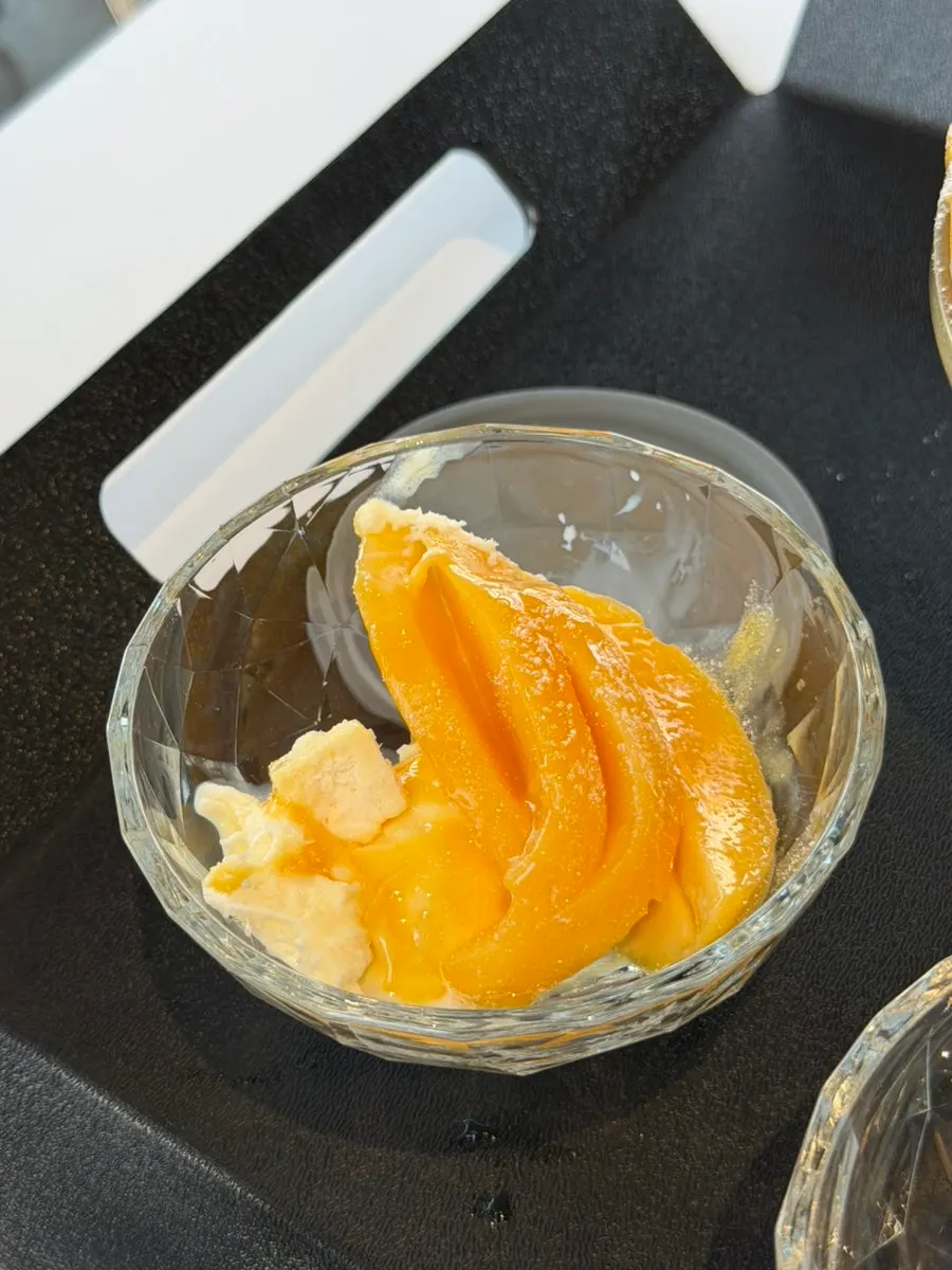 A big spoonful of mango scooped up