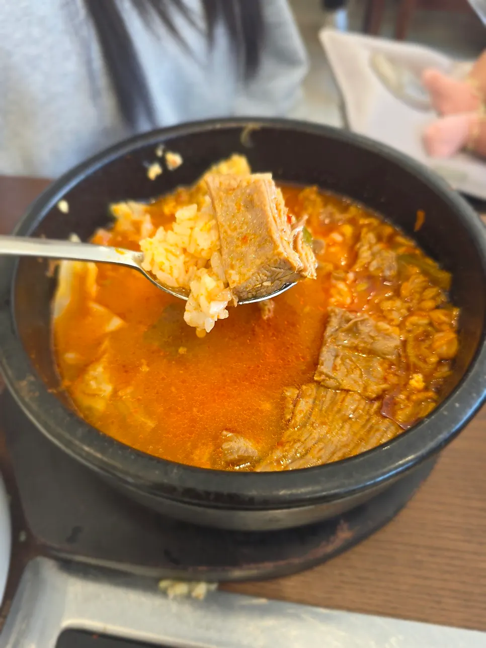 Spicy hanwoo jjabagi broth served with rice