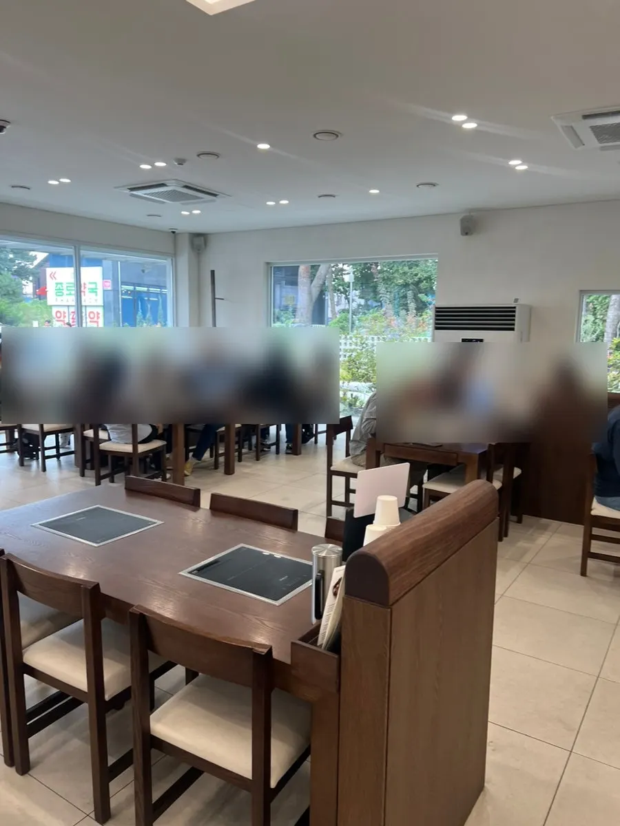 Spacious restaurant interior with floor-to-ceiling windows