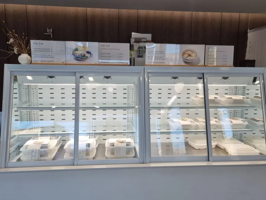 Snacks in a paper cup with the dessert zone in the background