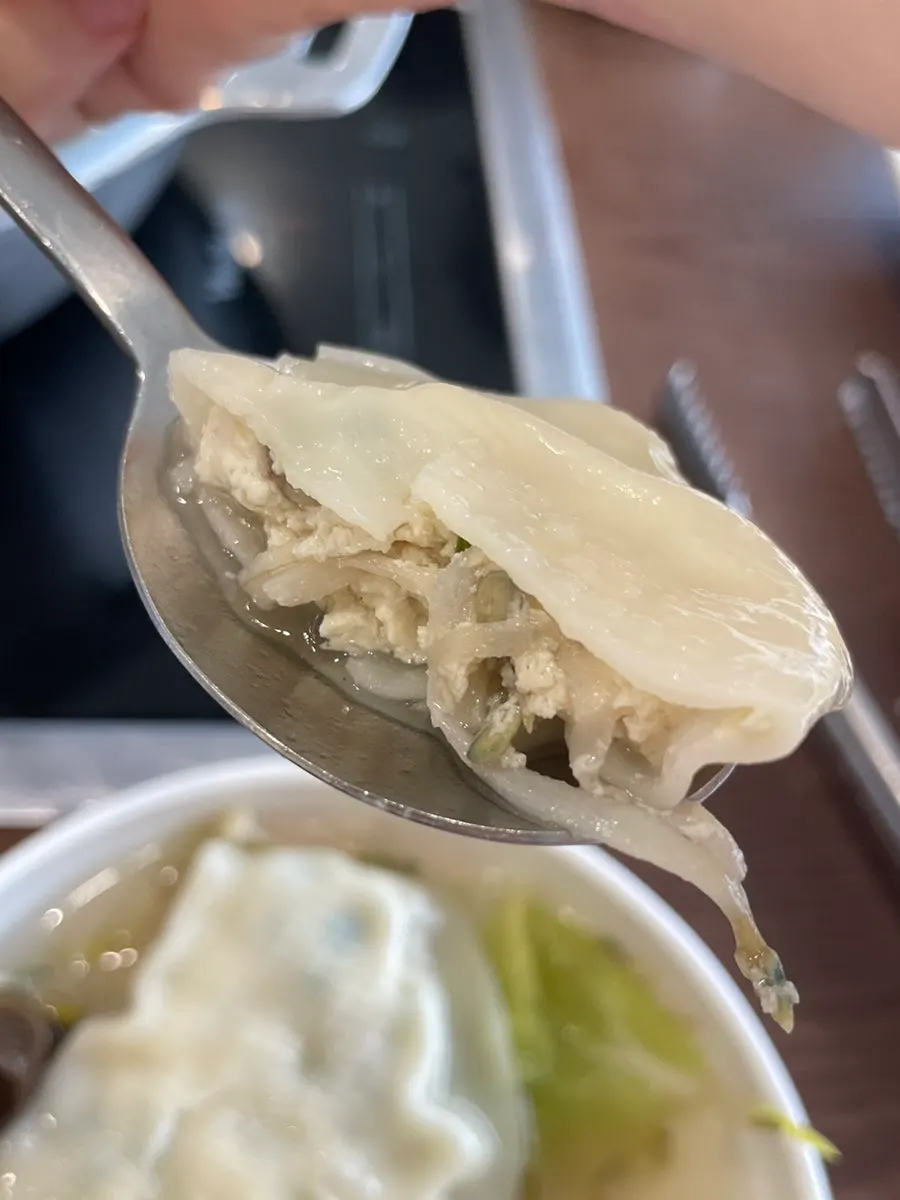 Close-up of a single dumpling taken out of the pot