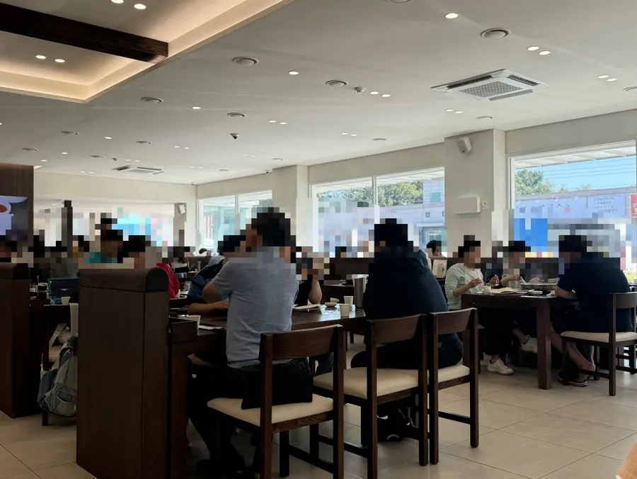 Fully packed restaurant interior at 11:30 on a weekend
