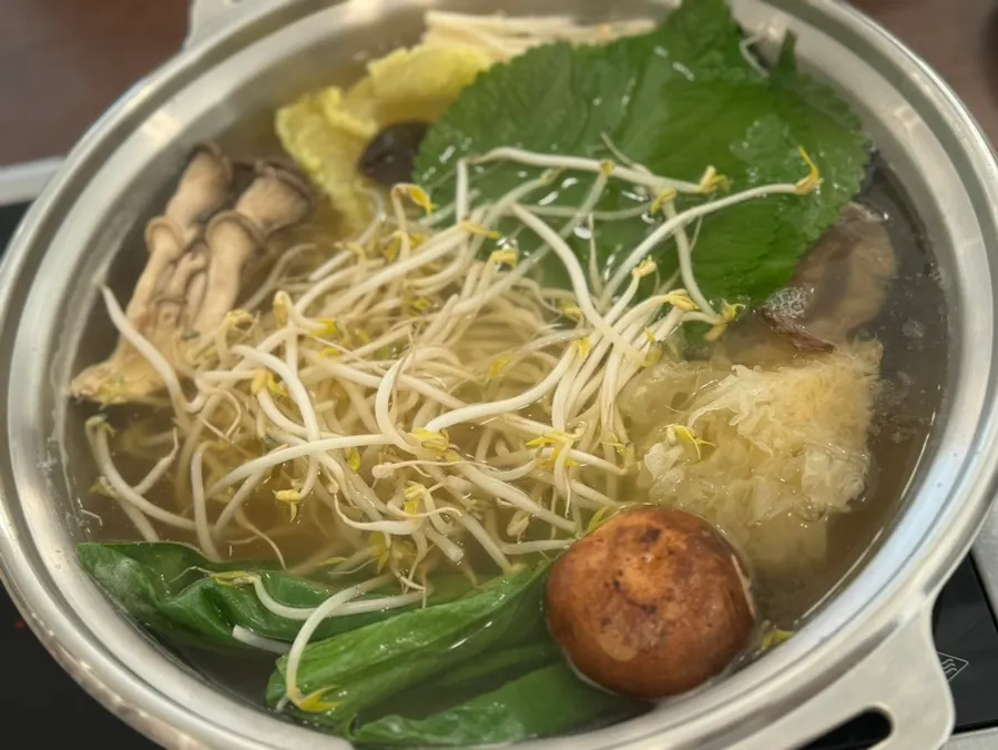 Mandu hot pot simmering with vegetables and mushrooms