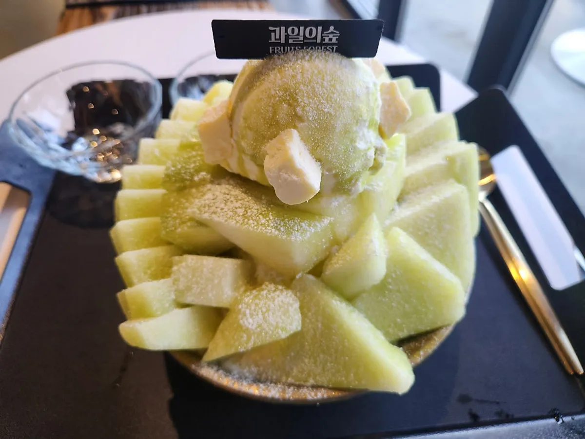 Bingsu and drinks menu board at Fruit Forest