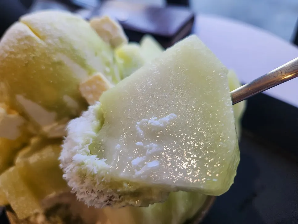 Snow bingsu topped generously with fresh melon