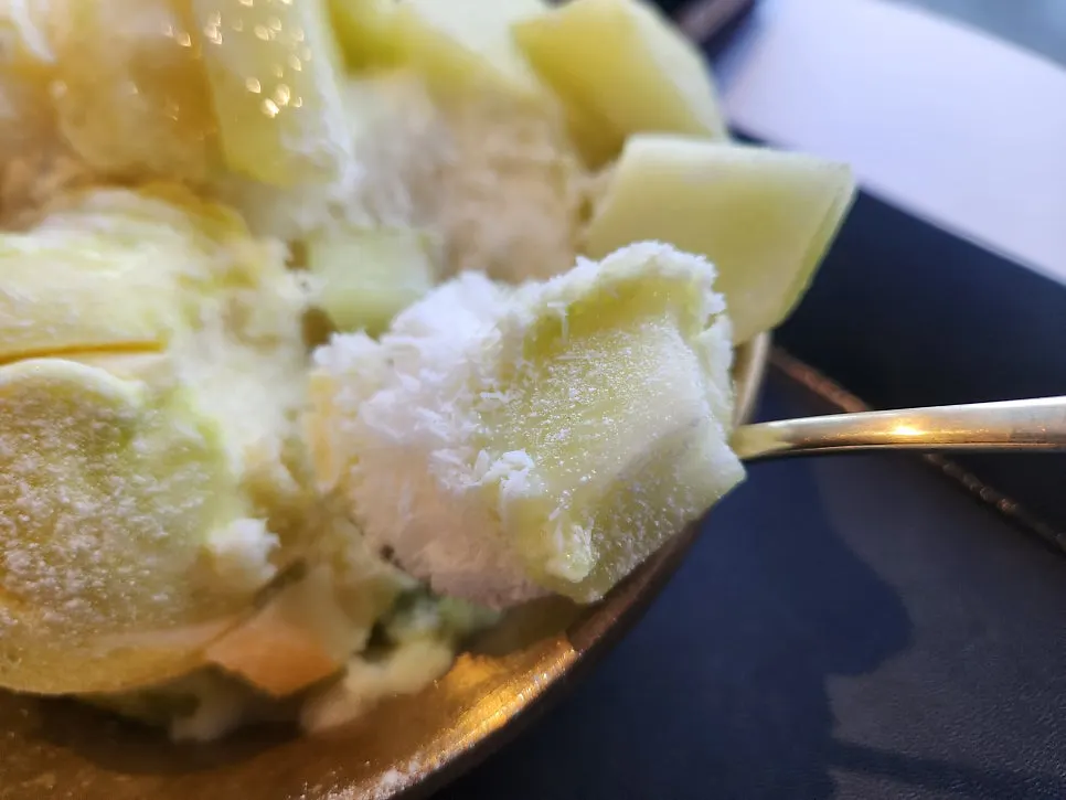 Cool snow ice with pieces of fresh melon