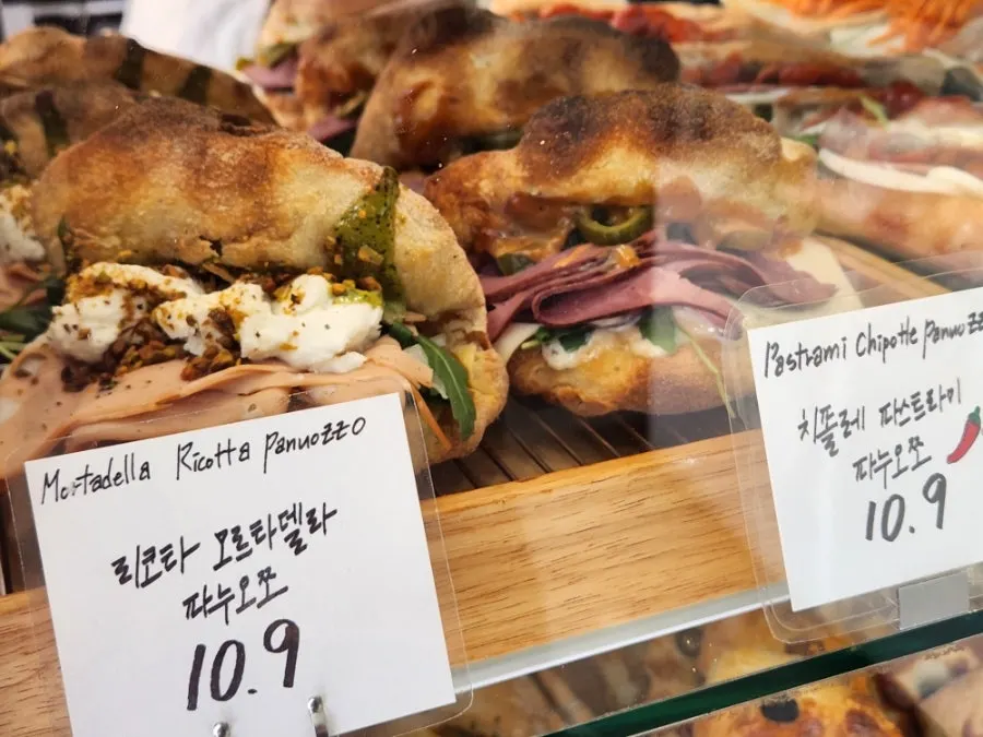 Showcase lined with different sandwiches