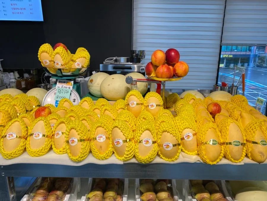 Store filled with fresh mango displays