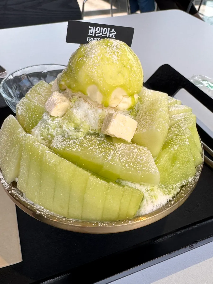 Melon snow bingsu piled high with fresh melon