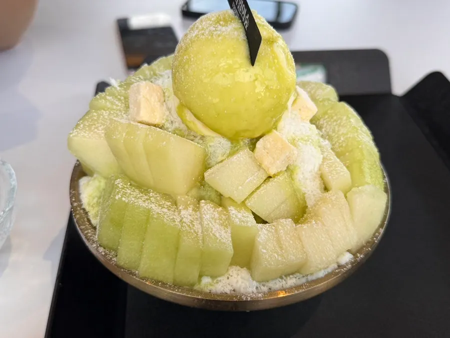 Milk-based snow ice beneath the melon bingsu