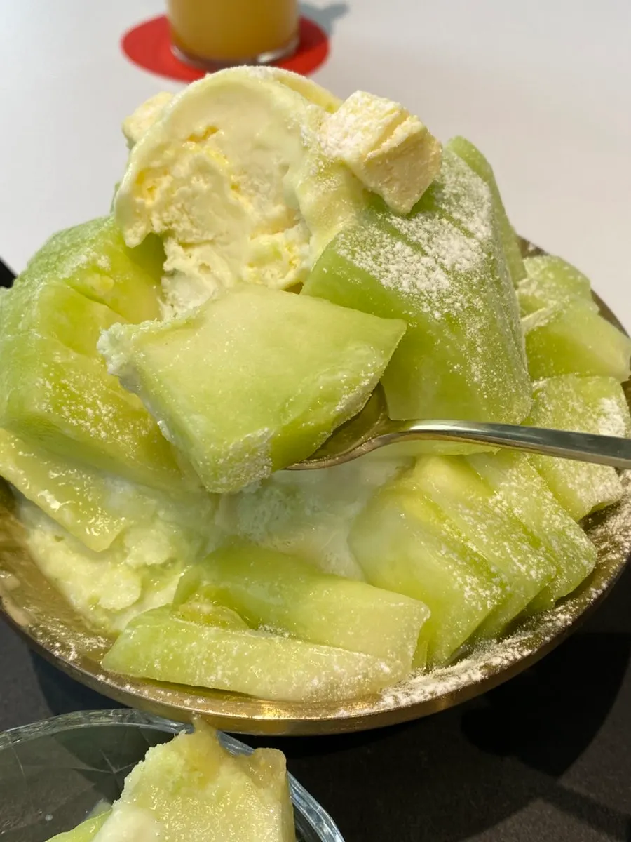 Juicy melon piece dripping with juice