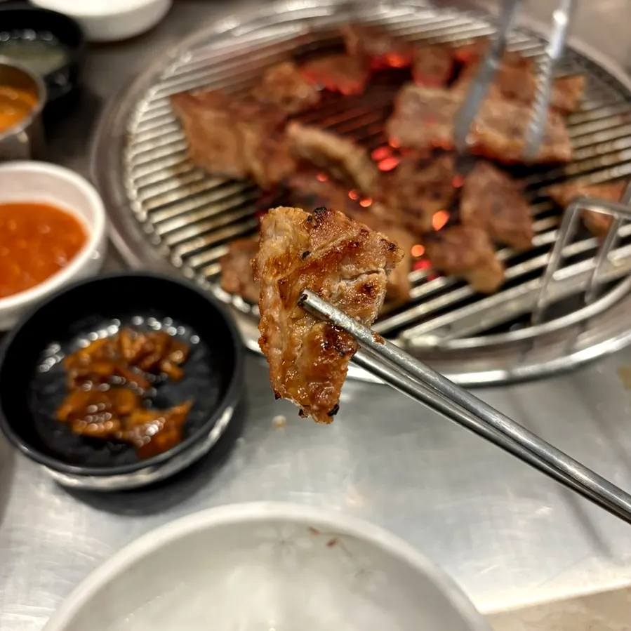A piece of well-grilled marinated pork rib