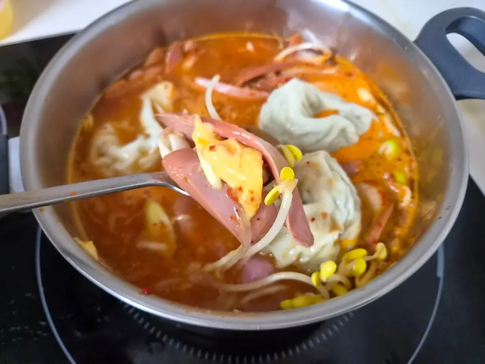 Budae jjigae boiled with added dumplings